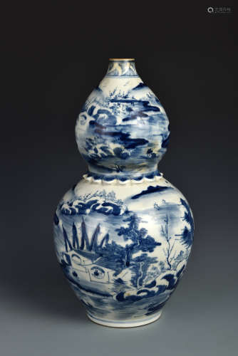 A BLUE AND WHITE LANDSCAPE GOURD SHAPED VASE