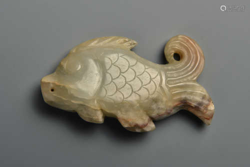 A WHITE AND RUSSET JADE CARP MING DYANSTY