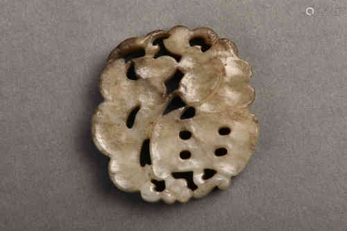 A WHITE AND RUSSET JADE PLAQUE MING DYNASTY