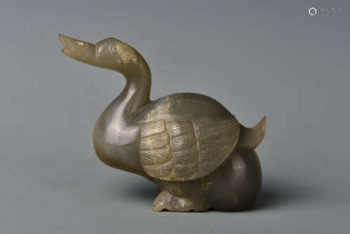 A CARVED CELADON DUCK QING DYNASTY