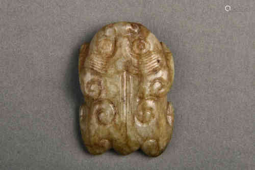 A PALE CELADON AND RUSSET JADE FROG 14TH CENTURY