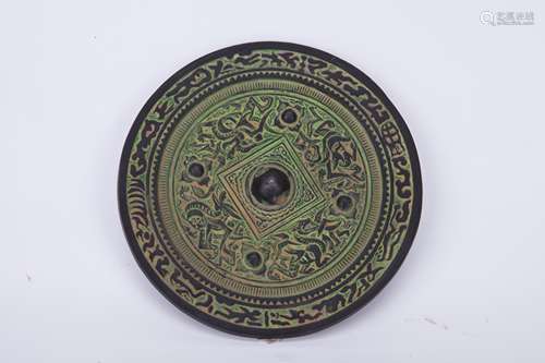 A CHINESE BRONZE MIRROR