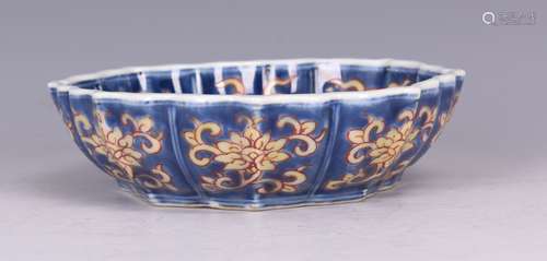 A BLUE GLAZED 'DRAGON' LOBED-RIM DISH, MING DYNASTY, QINGLONG PERIOD