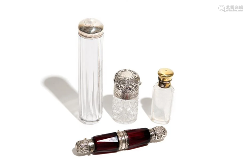 FOUR GLASS AND SILVER TOILETTE BOTTLES