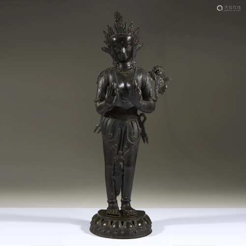 A Nepalese style patinated bronze standing fig…