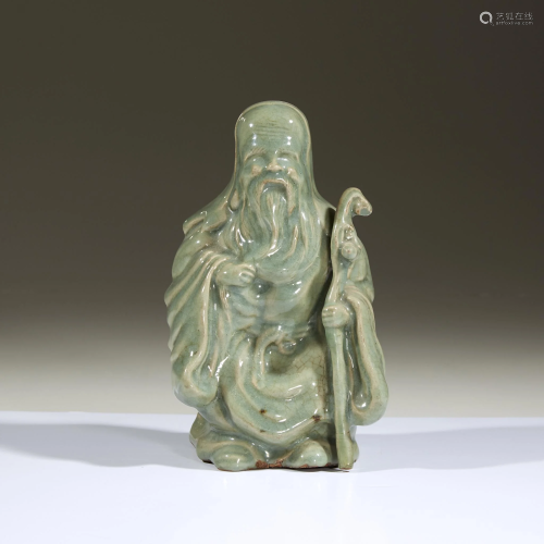 A Japanese celadon-glazed figure of Jurojin, prob…