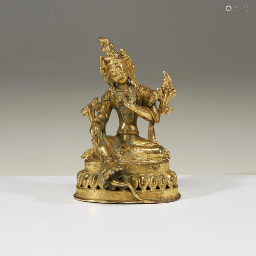 A small gilt metal figure of Tara,