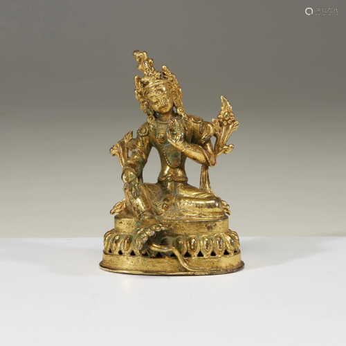 A small gilt metal figure of Tara,