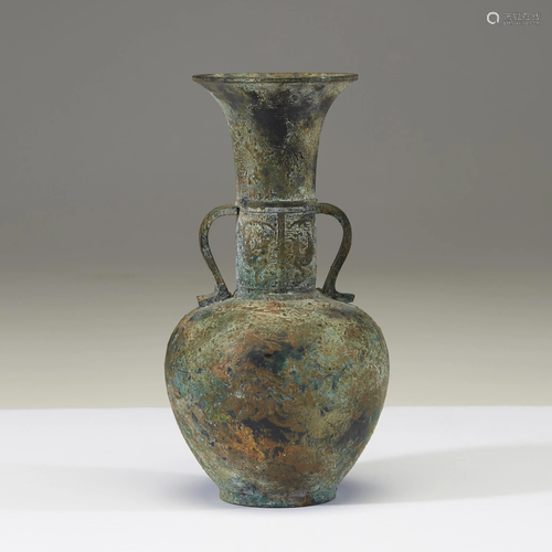 A Chinese archaistic patinated bronze bottle vase,