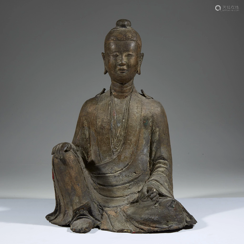 A Chinese bronze figure of a seated deity,