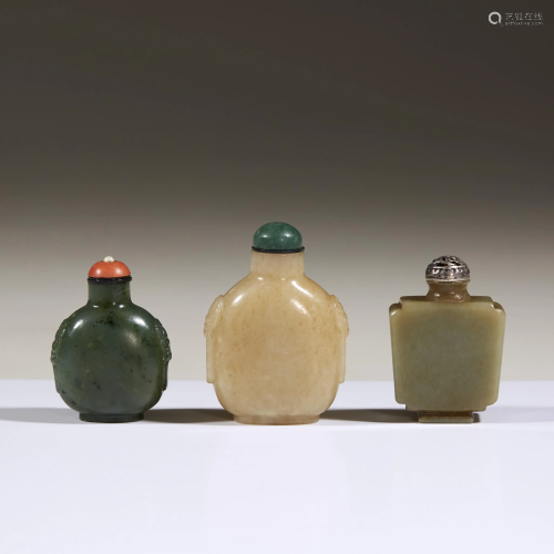Three Chinese carved jade snuff bottles,