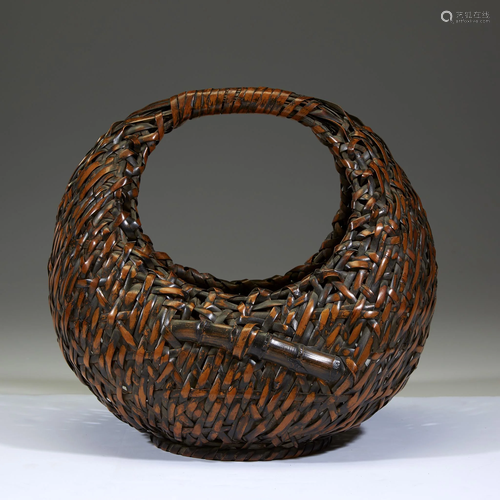 A Japanese woven bamboo â€œMoonâ€ basket,…