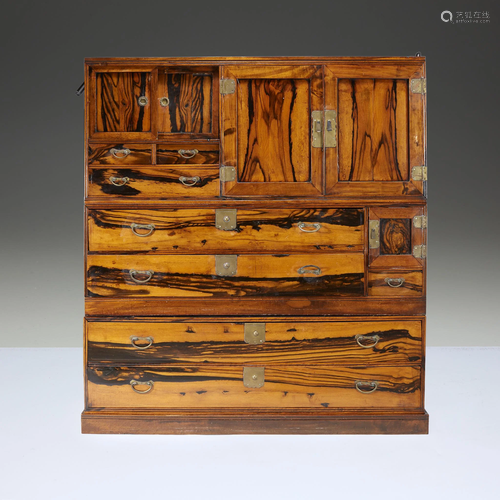 A Japanese three-part persimmon wood tansu,