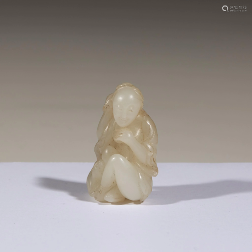 A small Chinese carved white jade figure of a bathing