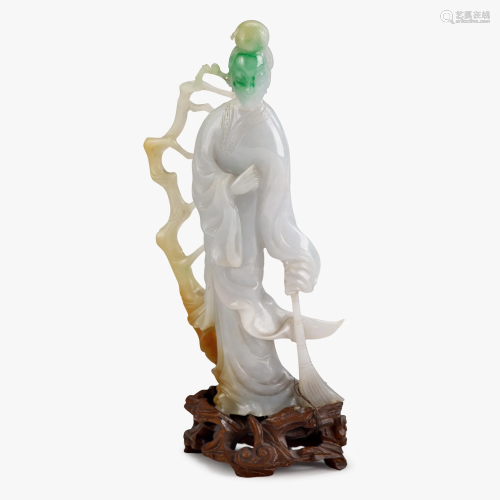 A Chinese carved multicolor jadeite figure of G…