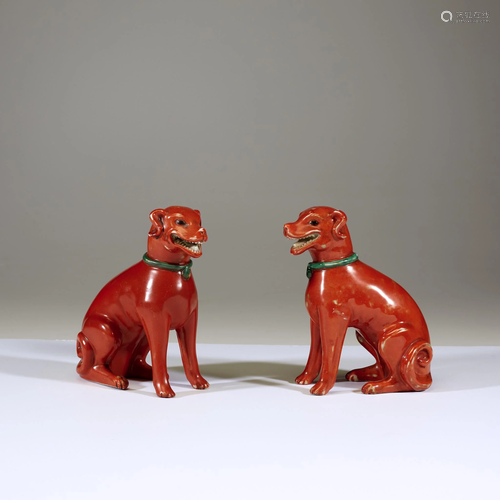 A pair of Chinese iron-red glazed porcelain figures of