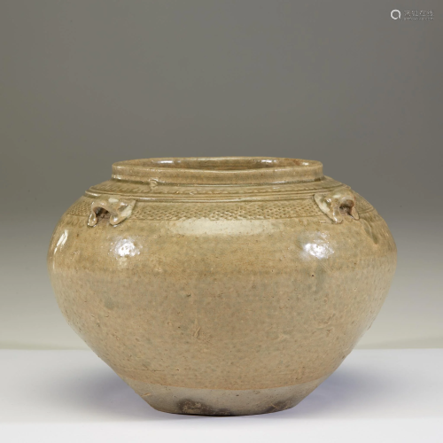 A Chinese celadon-glazed stoneware small jar, E…