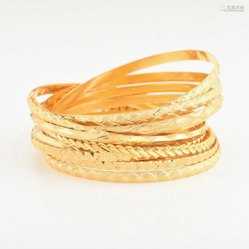 Collection of Twelve 22k Yellow Gold Bangle Bracelets.