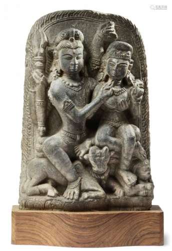 A NORTH INDIAN SANDSTONE CARVING OF SHIVA AND PARV…