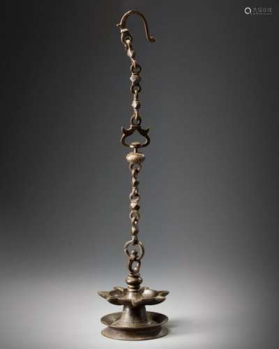 A KHORASSAN BRONZE HANGING OIL LAMP