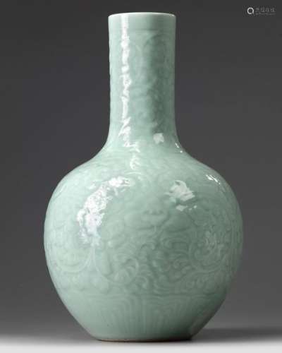 A CHINESE CARVED AND MOULDED CELADON GLAZED BOTTLE…