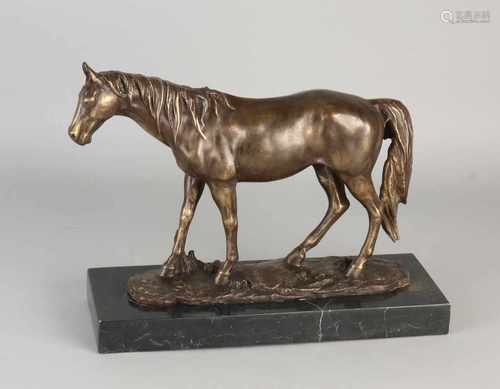 Bronze horse on black marble base. 21st century. Size: 24 x 30 x 11 cm. In good condition.