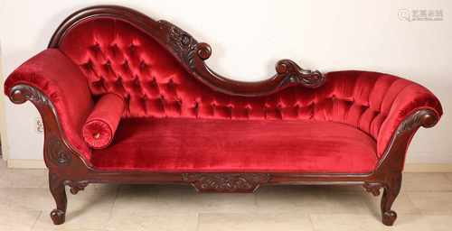 Large mahogany chaise lounge with red velvet upholstery and matching footstool. Second half 20th