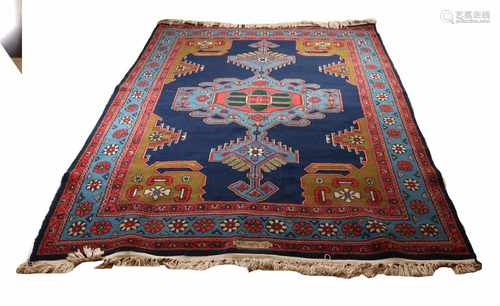 Persian rug in blue / red / brown etc. Size: 223 x 311 cm. In good condition.