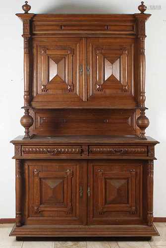 Solid French oak cupboard with prisms-shaped panels in the doors. Fully four full columns on the