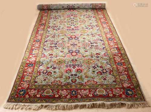 Persian rug entirely with floral decoration in red / green / cream etc. Size: 157 x 396 cm. In