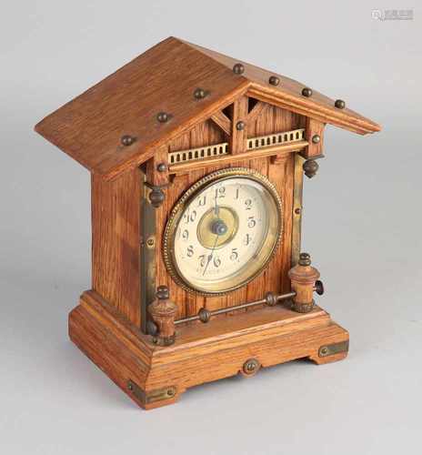 Antique German oak Gründerzeit clock with brass fittings. Junghans. Approximately 1900.