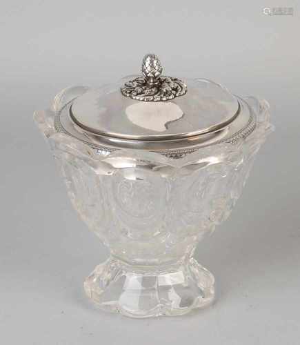 Glass sugar bowl on scalloped foot with scalloped edge, provided with a round silver knerren lid