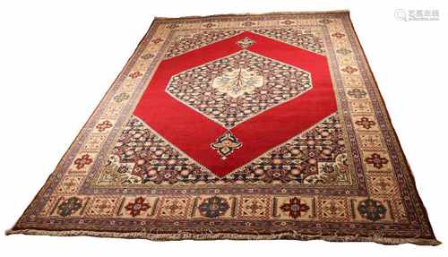 Persian rug in red / cream / brown etc. Size: 220 x 315 cm. In good condition.