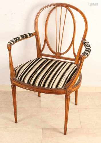 Antique walnut Louis XVI style armchair. Circa 1900. Dimensions: H 95 x 67 x 45 cm. In good