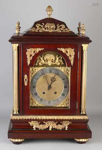 Large German mahogany table clock with gilt bronze ornaments. Eight day-watch, quarter-on battle