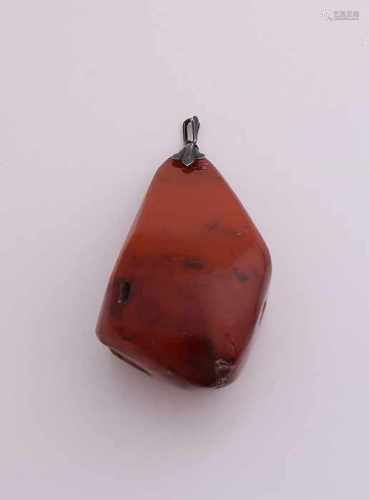 Silver pendant, 835/000, with a large piece of amber, 9x4x3cm. approximately 47.4 grams.