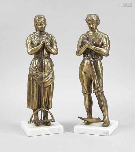 Two antique bronze colored composition metal figures. Circa 1920. Farmers husband and wife. Size: