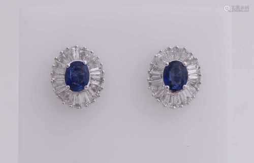 Ornate white gold earrings, 750/000, sapphire and diamond. Studs with a rosette is provided with a