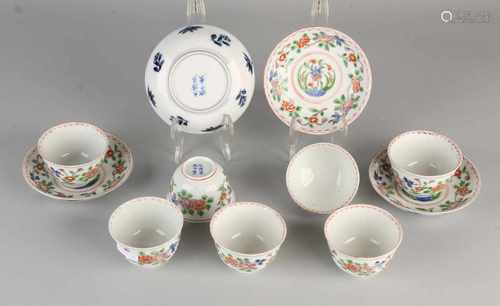 Chinese porcelain cups and saucers Rose Family with six characters soil brand and floral decor.