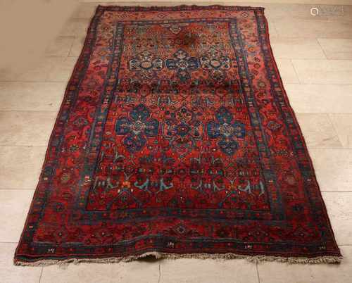 Old Persian rug. Floral, red etc. light damage. Size: 236 x 132 cm. In reasonable condition.