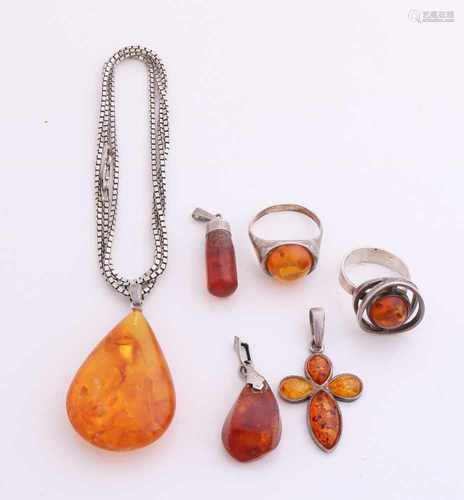 Lot of silver jewelry with amber, amber with two rings, three pendants with amber and a necklace