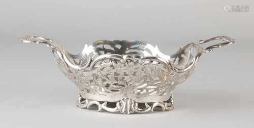 Ornate silver bonbon basket, 833/000, oval-cut model to cut an oval base with two handles of