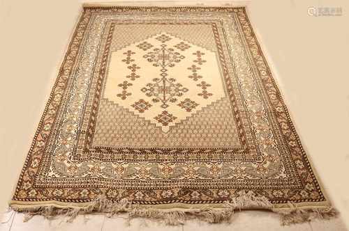 Old Persian rug. Floral, cream-brown. 20th century. Size: 235 x 168 cm. In good condition.