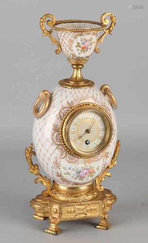 19th Century French porcelain vase pendulum. With gilt bronze mounts, gold figures and decor.