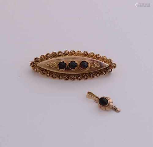 Yellow gold brooch and pendant, 585/000, with garnet. A marquise-shaped brooch zone with buttons and