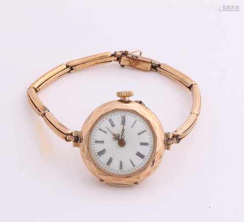 Yellow gold watch, 585/000, with double tape. Old watch with a round case with a faceted edge