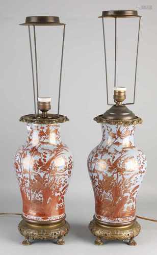 Two antique Japanese Satsuma porcelain table lamps with gold decor and bronze mounts. Circa 1900.