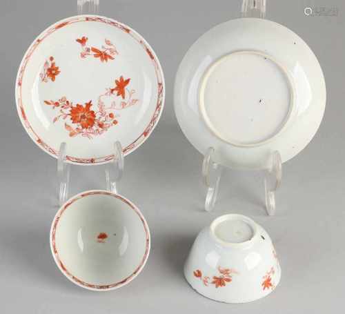 Two 18th century Chinese porcelain cups and saucers. Milk and blood / floral. Both cups hairline.