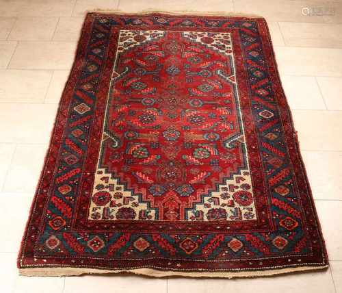 Persian rug. Multi-colored, red-blue-black et cetera. Size: 120 x 195 cm. In good condition.