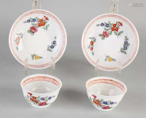 Two 19th century Chinese milk glass hand-painted cups and saucers. Floral decor. Size: 6 x 11.5 cm